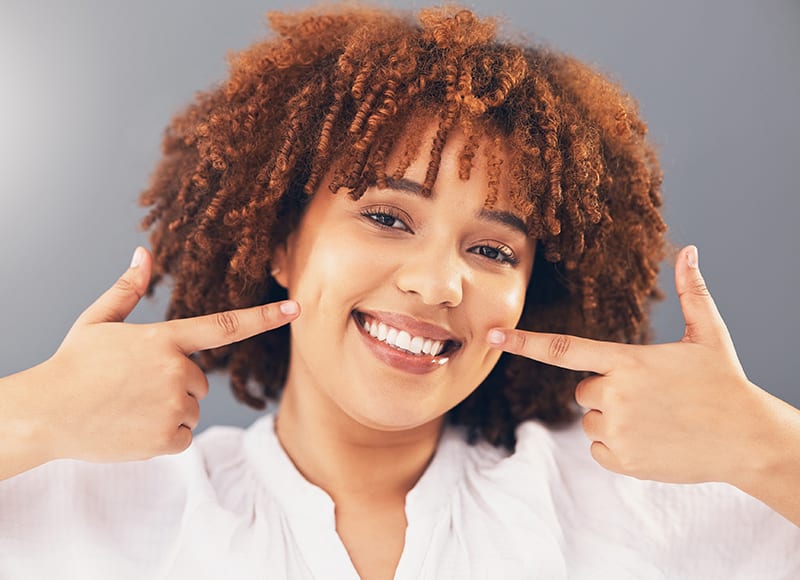 A patient pleased with her smile after specialised treatment at Refresh Dental