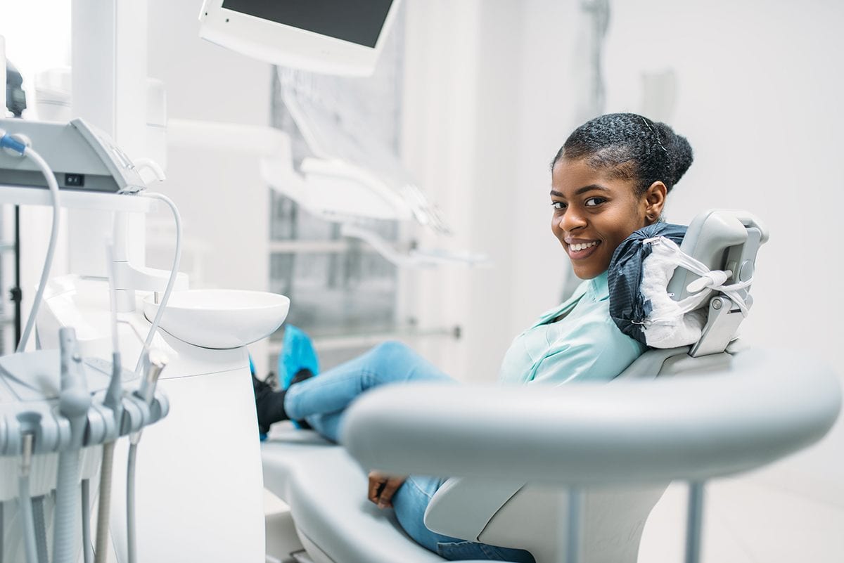 A patient relaxed in the treatment chair at Refresh Dental